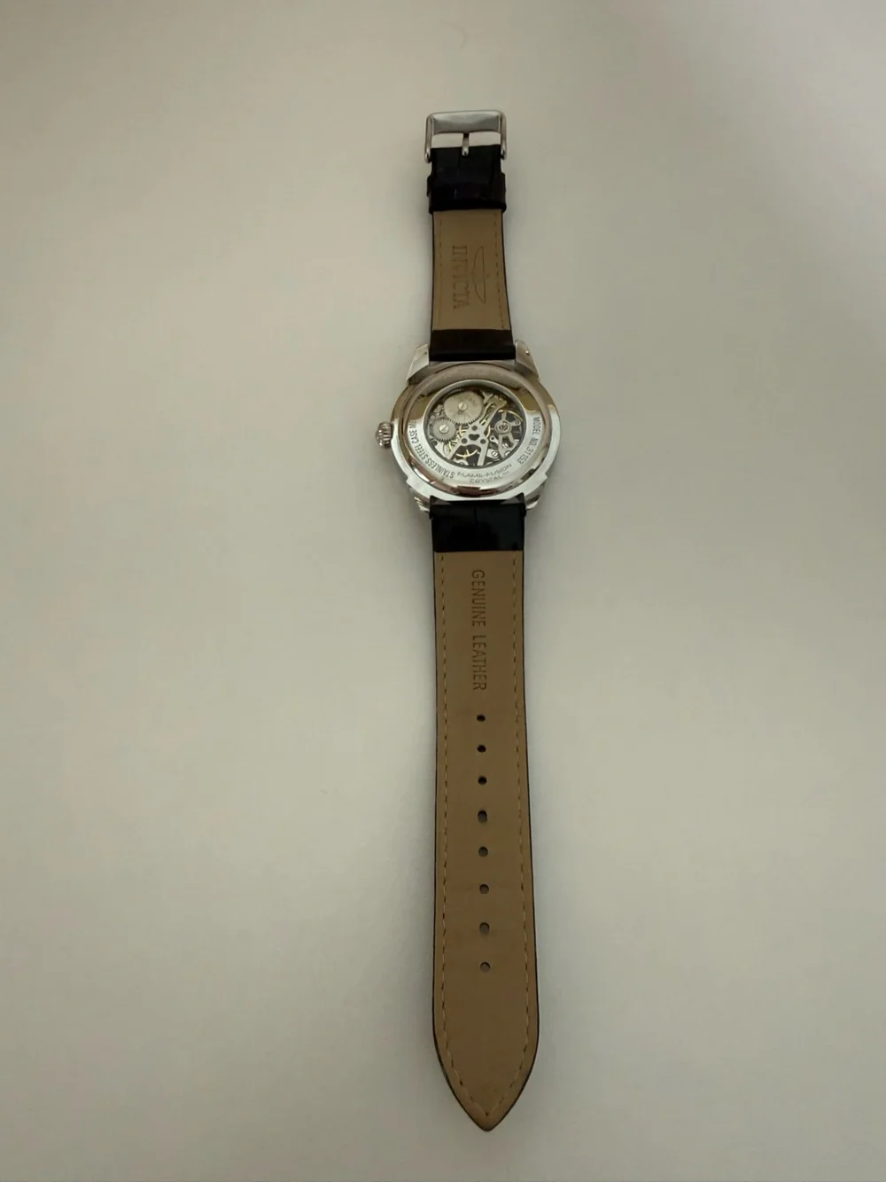 Invicta Men’s Silver Skeleton Dial Watch with Black Leather Strap